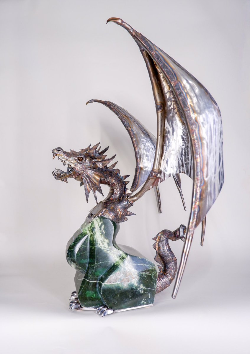 thegorilladidit's tweet photo. A dragon rendered in stainless steel and jade. There is no casting in my work. All of the stainless is welded, and I carved the jade. How do you feel about this one? https://t.co/hdZfnsGv5J