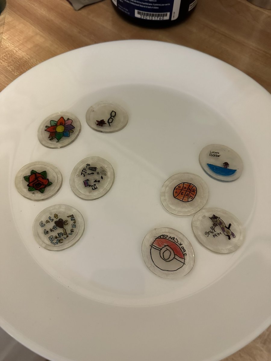 Turning the decorated lids into charms for band students. Handing them out this week.