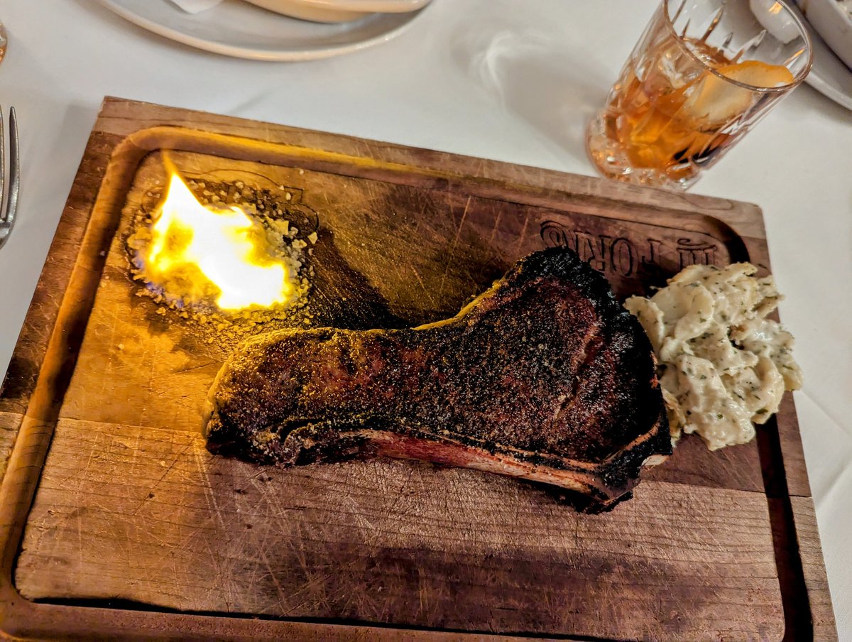 The Texas Birthday Cake... Dry Aged Bone in Strip, sea salt on fire, old fashioned and a spoon of sides