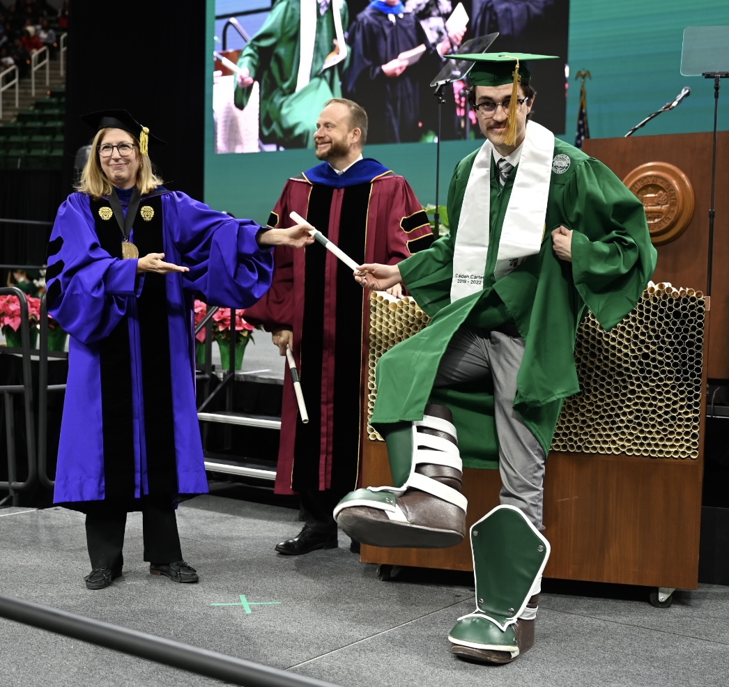 michiganstateu's tweet photo. One of our favorite MSU traditions: The seniors who are Sparty wear the boots at graduation to reveal their secret identity. 

Congrats, Caiden and Jacob! Thanks for representing the Green and White so well. #SpartanGrad22 https://t.co/83AIA3HAFW