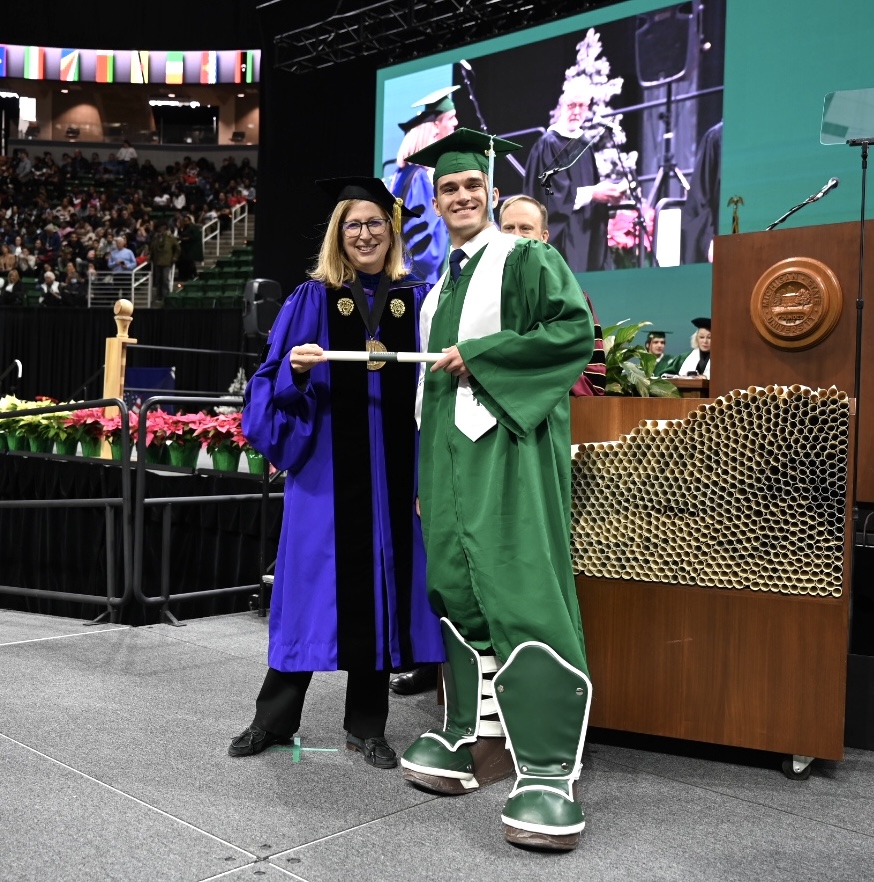 michiganstateu's tweet photo. One of our favorite MSU traditions: The seniors who are Sparty wear the boots at graduation to reveal their secret identity. 

Congrats, Caiden and Jacob! Thanks for representing the Green and White so well. #SpartanGrad22 https://t.co/83AIA3HAFW