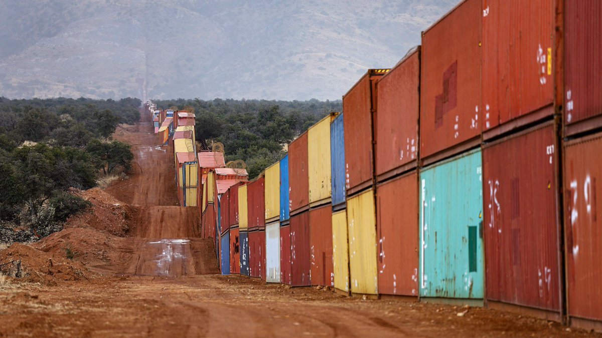 ackocher's tweet photo. There may be no clearer materialization of the idea that globalization facilitates the flow of goods while limiting the flow of people than a (illegal) border wall constructed out of shipping containers. https://t.co/tQlD6ANiWe
