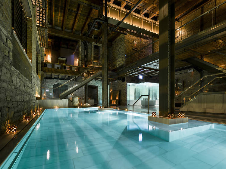 Breathing new life into the ancient tradition of Greek and Roman bath houses, Aire Ancient Baths is a singular spa experience in Chicago. The awe-inspiring space, which is built inside an old factory in River West, is like a hidden bunker designed for peaceful retreats.