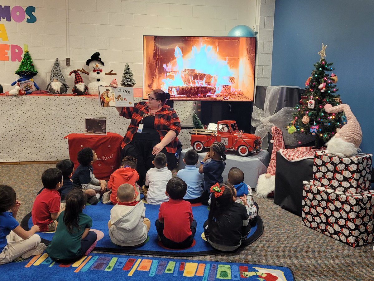 MrsPlascensia's tweet photo. Nurse Brown and Mr Zepeda joined us in the library for a book by the "fireplace"! @LivelyEagles #LivelyReads #WinterReadAloud https://t.co/AkPREy3KVF