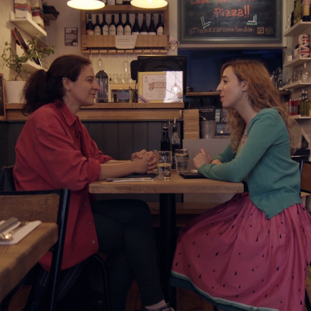 Olivia has something to tell her best friend Carmen in Can We Order First? 

Find out what that secret is for yourself when Can We Order First?  lands on #Lesflicks in 4 days!