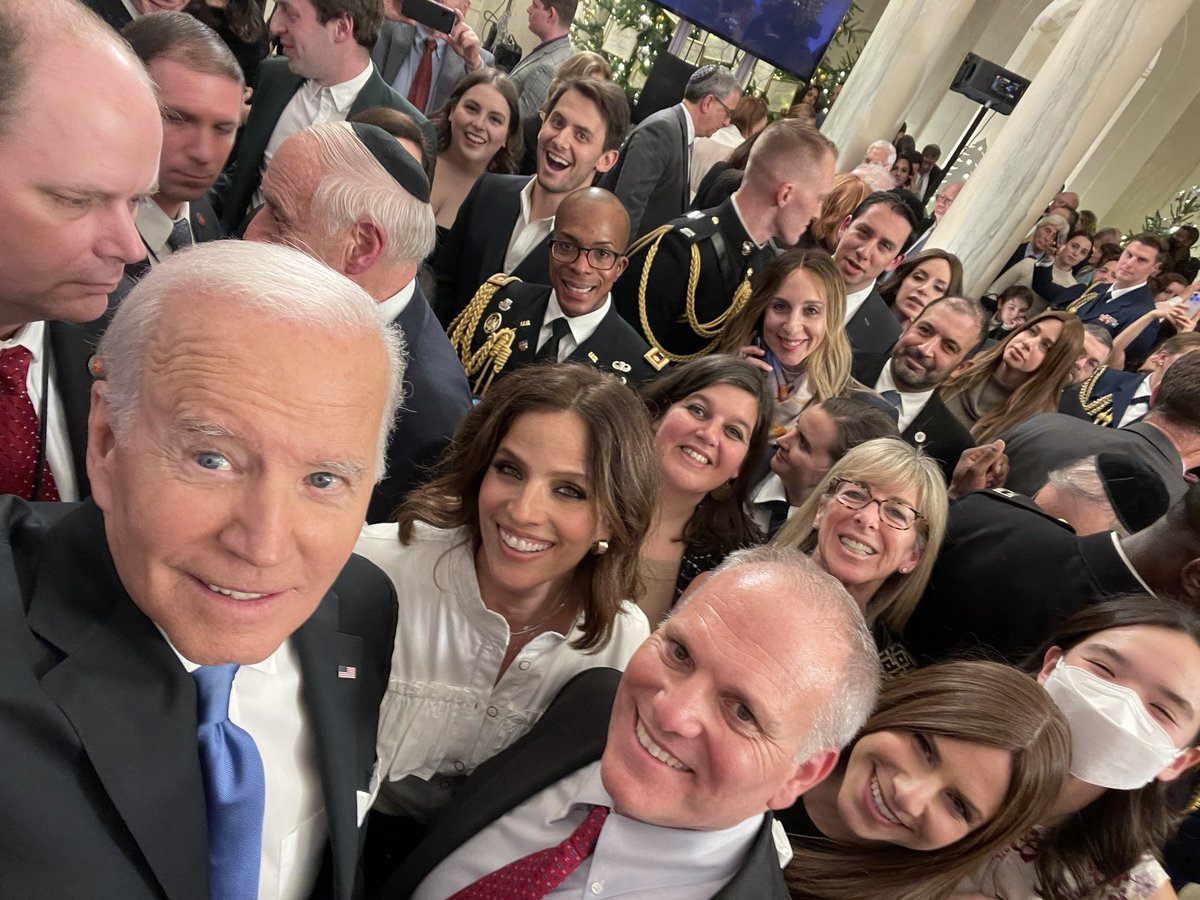 As the tallest person in a room full of tiny Jews, it falls to Biden to personally take the White House Hanukkah party selfie (via <a href="/JRabhan/">JodyRabhan</a>):
