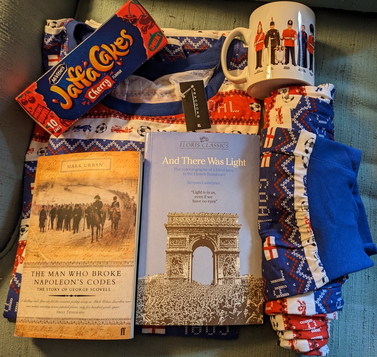 MartinKoenigsb2's tweet photo. #ChappyChanukah !! Does my sister know me or what? Awesome Chanukah package- UK Lions themed Ugly Christmas Sweater (Jumper?) PJs, a Military Mug, Cherry Jaffa Cakes and two books... #MerryChanumas #19thCenturyHistory #20thCenturyHistory #Cryptographers #NapoleonicWars https://t.co/RyaejEuhru