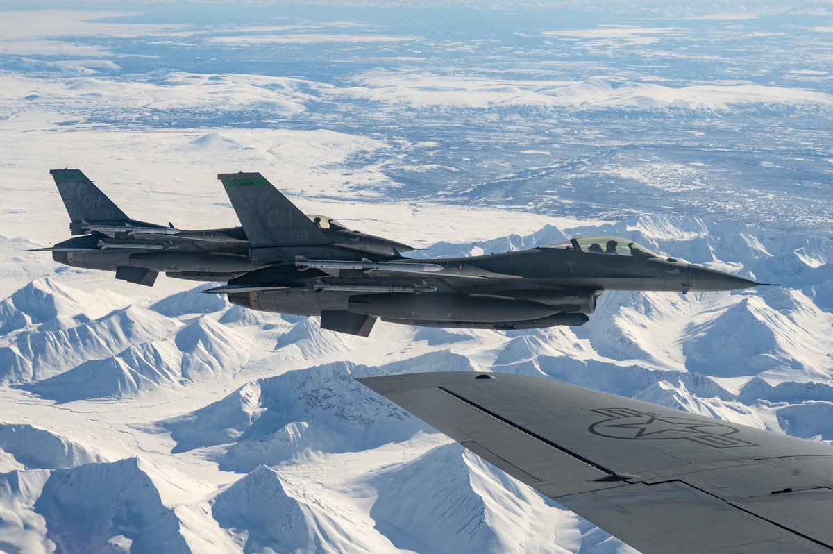 A USAF #F16 Fighting Falcon, assigned to the 180th Fighter Wing, is refueled by a KC-135 Stratotanker aircraft, assigned to the 97th Air Refueling Squadron, during U.S. Northern Command Exercise #ARCTICEDGE 2022, March 15, 2022. (U.S. Air Force photo by Staff Sgt. Taylor Crul)