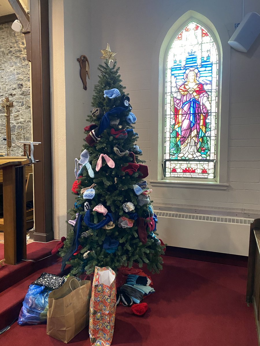 104 hats, 59 mitts/gloves, 20 scarves, 14 socks, and 1 pair knitted slippers so far!