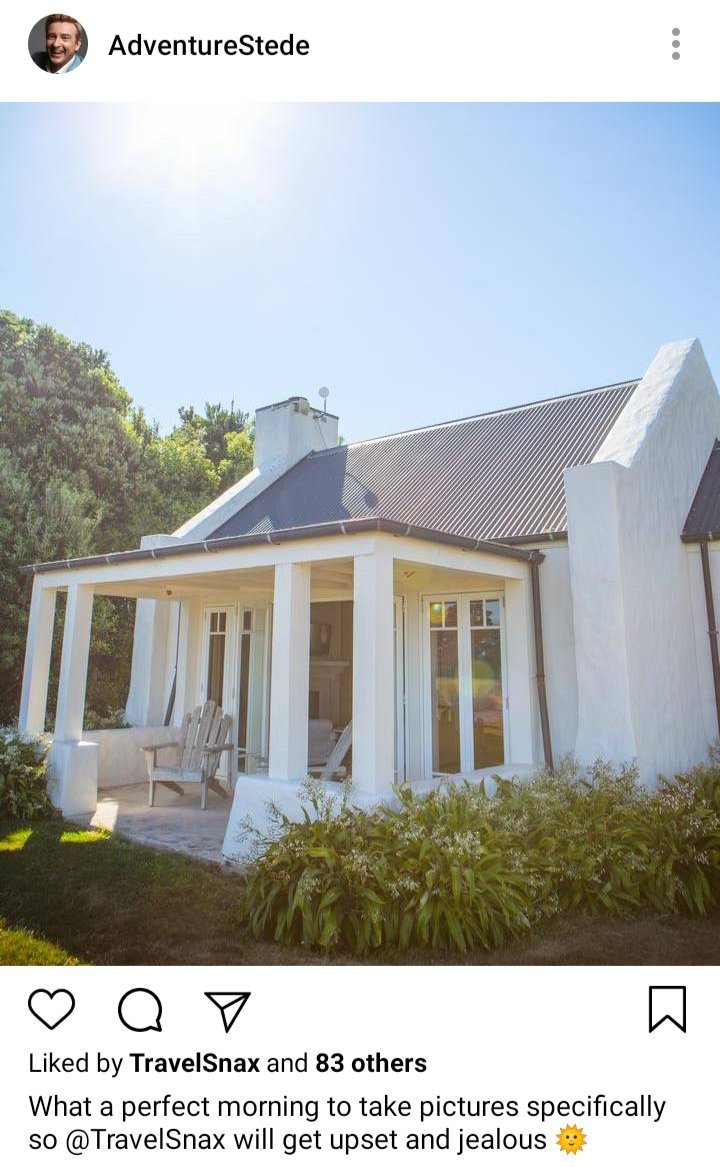Stede's IG. Photo of their cottage in the morning sun. Caption reads "what a perfect morning to take pictures specifically so @TravelSnax will get upset and jealous!" 
