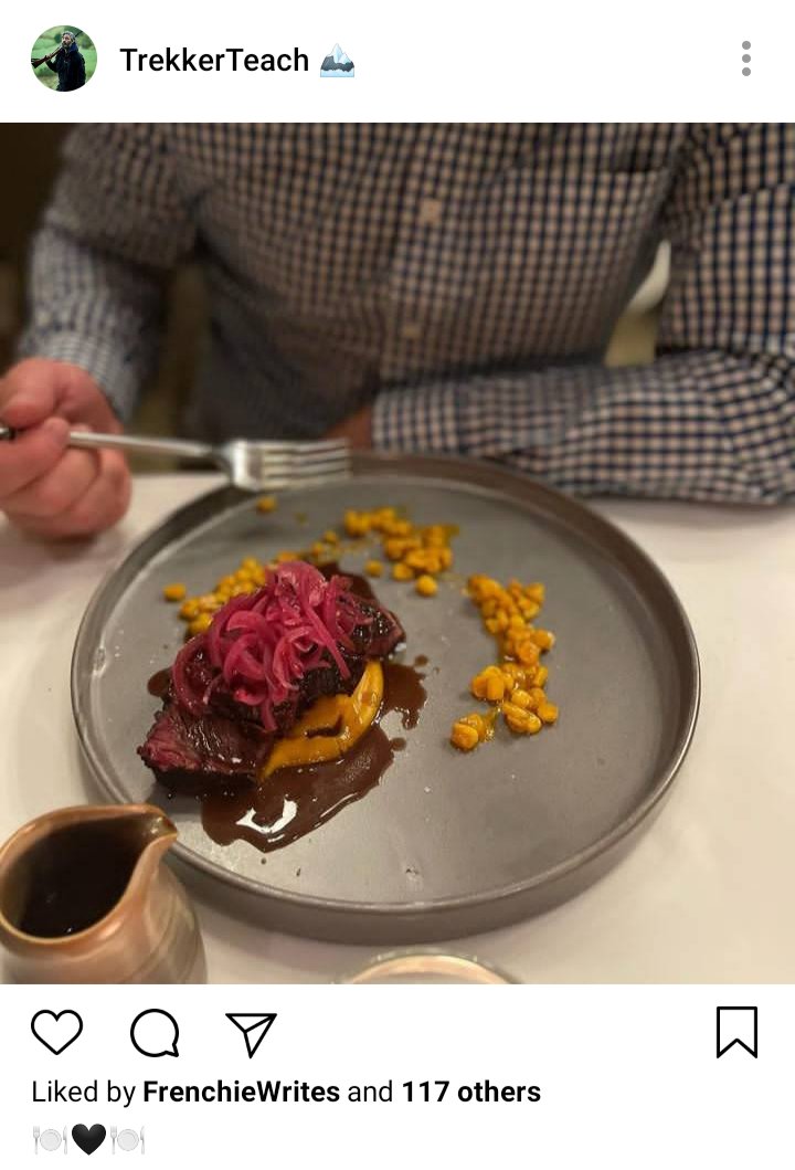 Ed's IG. Photo of Stede in front of a plate of food, a steak. Caption reads "🍽️🖤🍽️" 