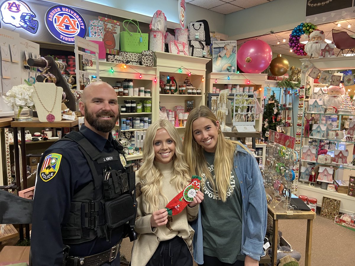 AthensAL's tweet photo. Shoppers in Downtown received a police-issued Christmas challenge: do a good deed. The family of Levi Hays, a local student who died in August, gave APD a bag of socks. Each had a candy cane & good deed challenge that said #LiveLikeLevi. Officer Kimery issued the challenges today https://t.co/OygwXtY7J4