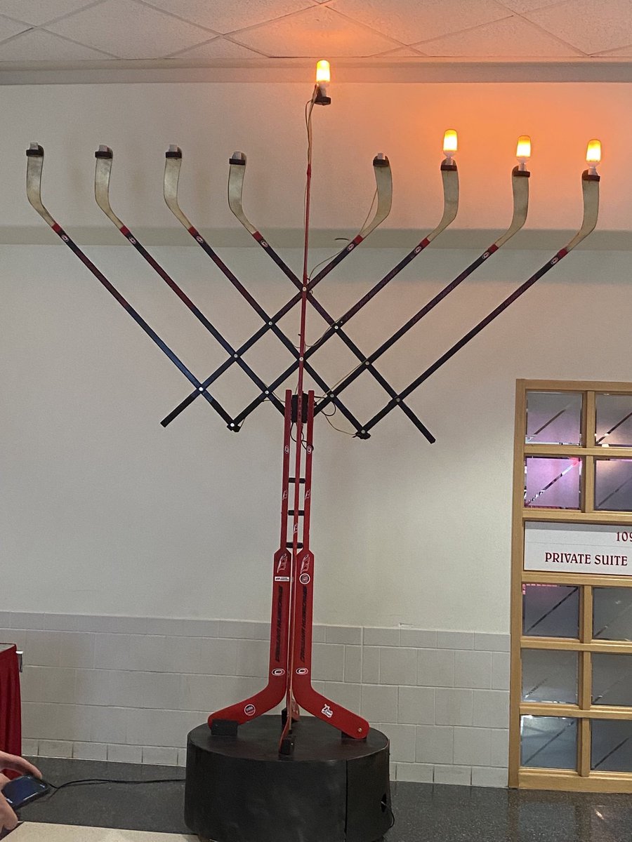 DanShuftan's tweet photo. A Raleigh based rabbi created and gave Carolina Hurricanes a menorah made out of hockey sticks. Pic via @danlatorraca https://t.co/JoL8fwyZne