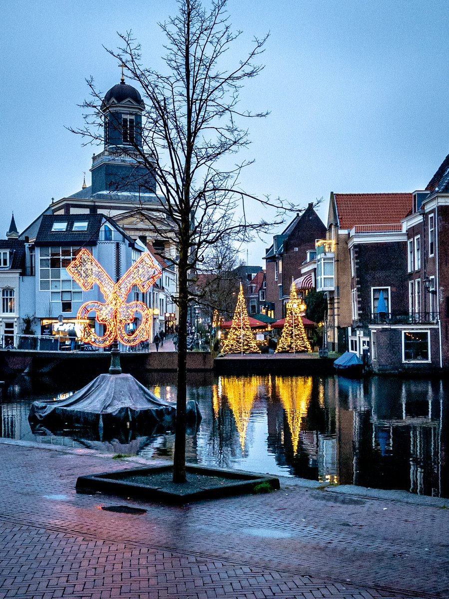 City decorated for the winter Holidays, Leiden, Netherlands #Leiden #Netherlands #bestofnetherlands #streetphotography#reflection #stadvanontdekkingen #canals #rivers #bridge #church #tower #religion #lights #symbol #design #