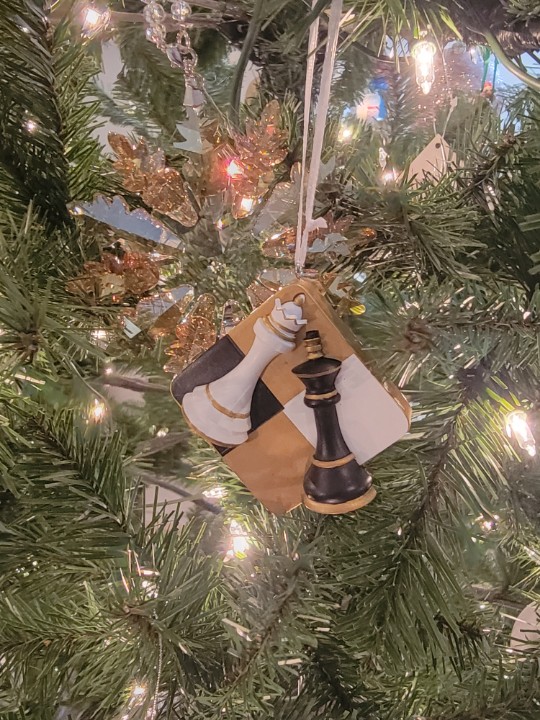 Only sentimental over few items, Emma hung two ornaments that carried any value. The White Queen, of course, the cherished one from <a href="/Occulta_Malum/">Malik | Loki</a> a Christmas past.