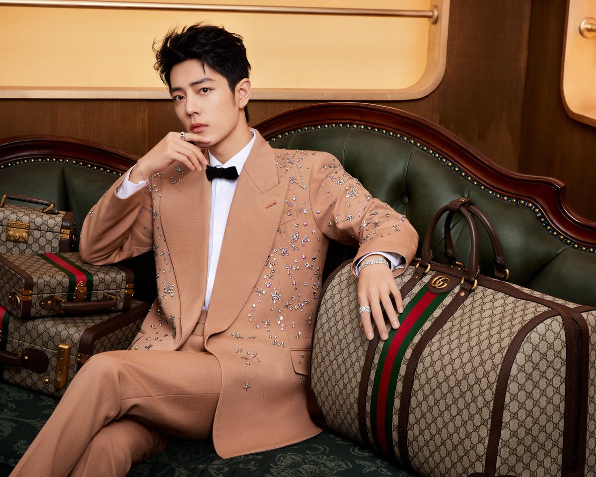 gucci's tweet photo. Global Brand Ambassador #XiaoZhan appeared in a #GucciCruise23 sartorial look alongside Gucci Savoy luggage from the #GucciValigeria collection. #GucciTailoring https://t.co/s5JxGZak7U