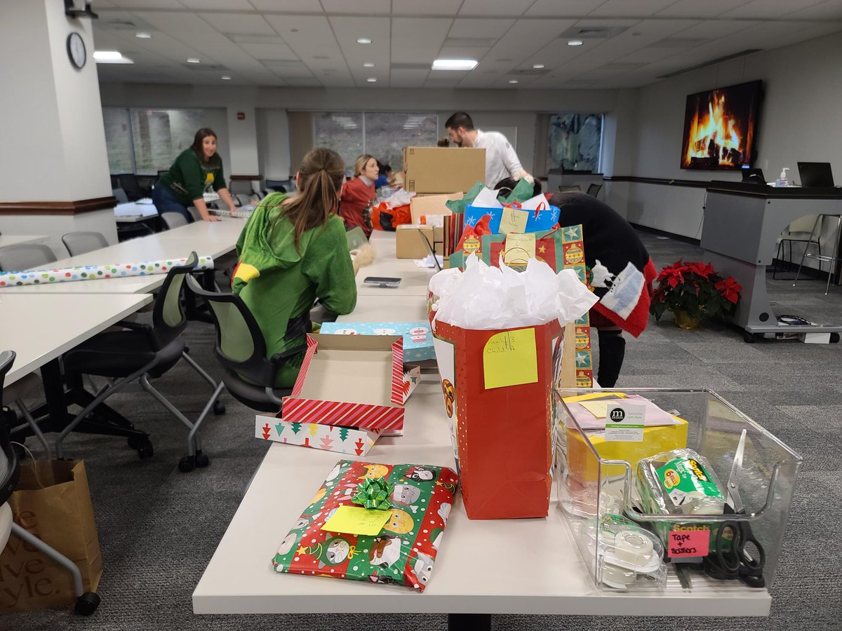 DefinitiveHC's tweet photo. Our team got into the festive spirit last week while wrapping presents for our holiday gift drive in support of @BHCHP &amp; the Holiday Dreams Foundation. 

Thank you to our employees for providing 150+ individuals and families with holiday gifts.

#DefinitiveCares https://t.co/GHbWThrPLu