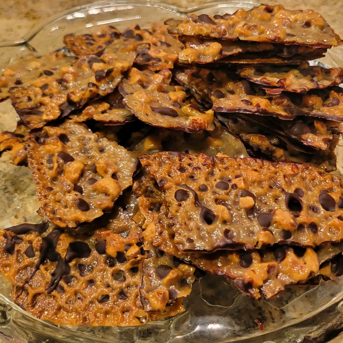 BbBroomfield's tweet photo. Our Cookie Countdown continues with the latest #BakeOfTheWeek - Free-Form Hazelnut Florentines!
These Hazelnut Florentines are light and lacy, with just the right amount of sweet and nutty flavor. The dark chocolate coating on the bottom makes them a perfect holiday treat! https://t.co/ewmzoOTqSv