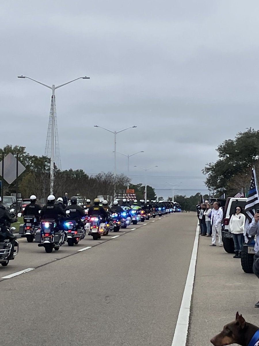 The funeral procession has begun for two slain Bay St. Louis police officers