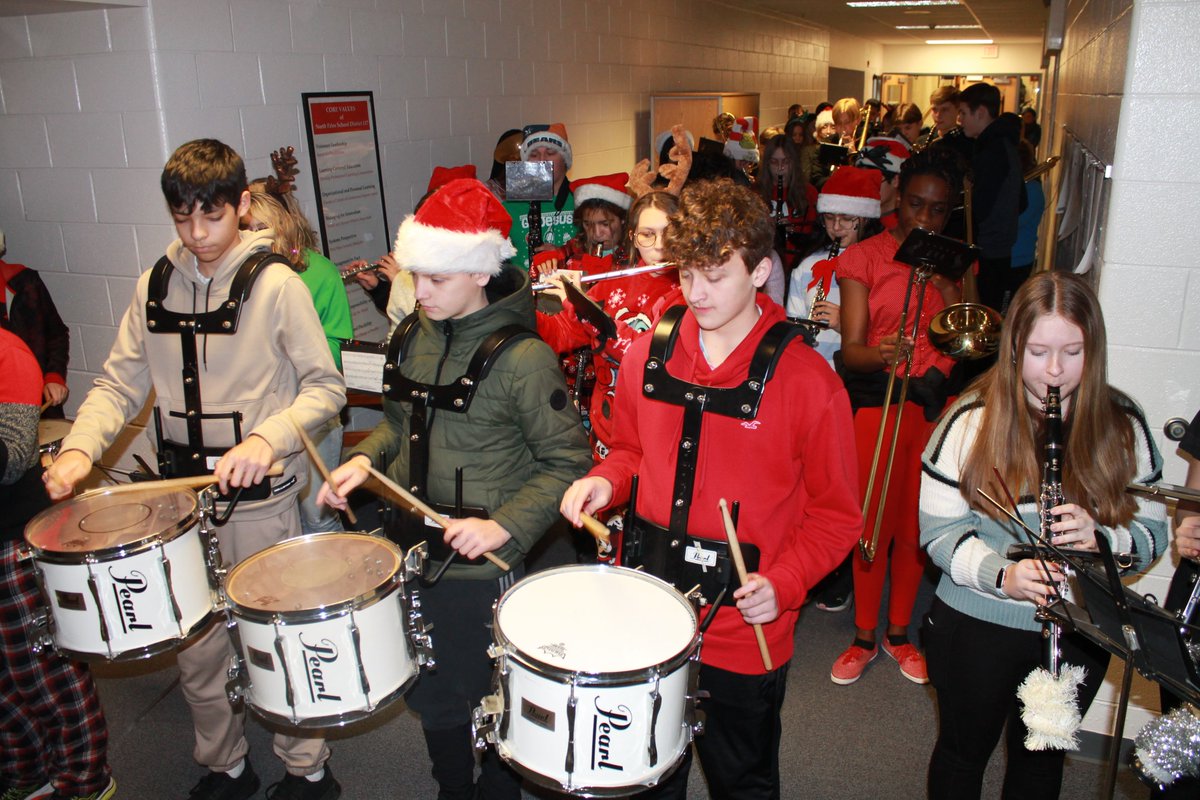 Conrady's eighth-grade choir and band spread holiday cheer during performances at the district office, #npd117