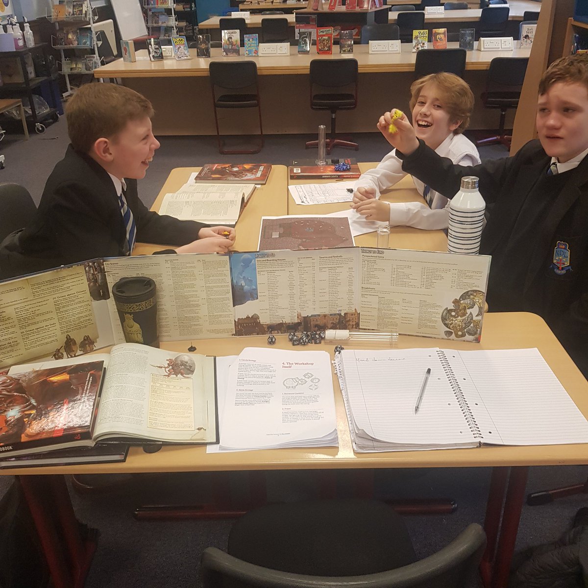 LibLourdes's tweet photo. It was an epic #SchoolLibraryRPG day today, with 3 S1 groups playing the @professorbeej Claus for Concern campaign - their 1st try at #DND. Another group played #Warhammer40K then there was the usual after school group. 5 games in 1 day 😮😂 https://t.co/l2xnsiQcd4