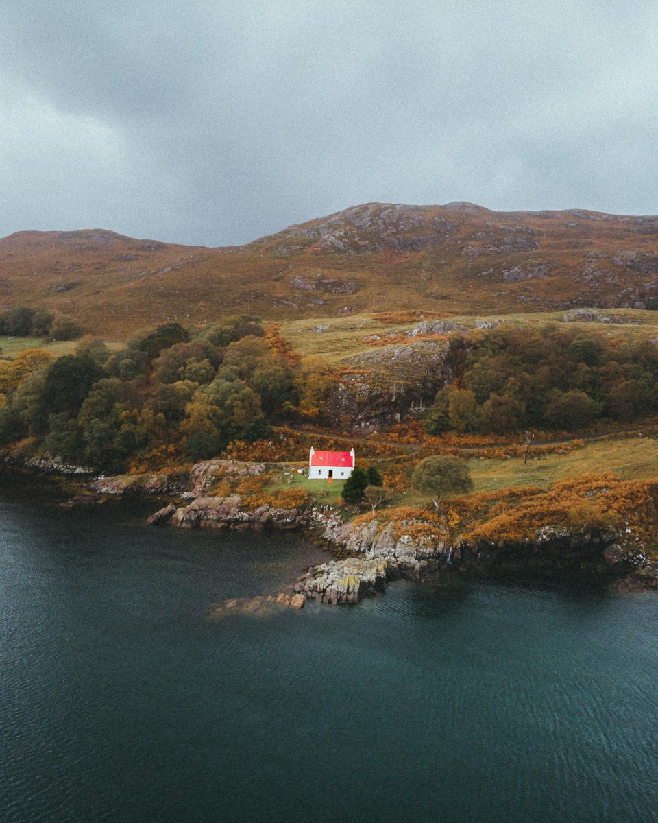 This red roof cottage nestled somewhere in the Scottish Highlands. From u/sadieellenorgrace on /r/mostbeautiful