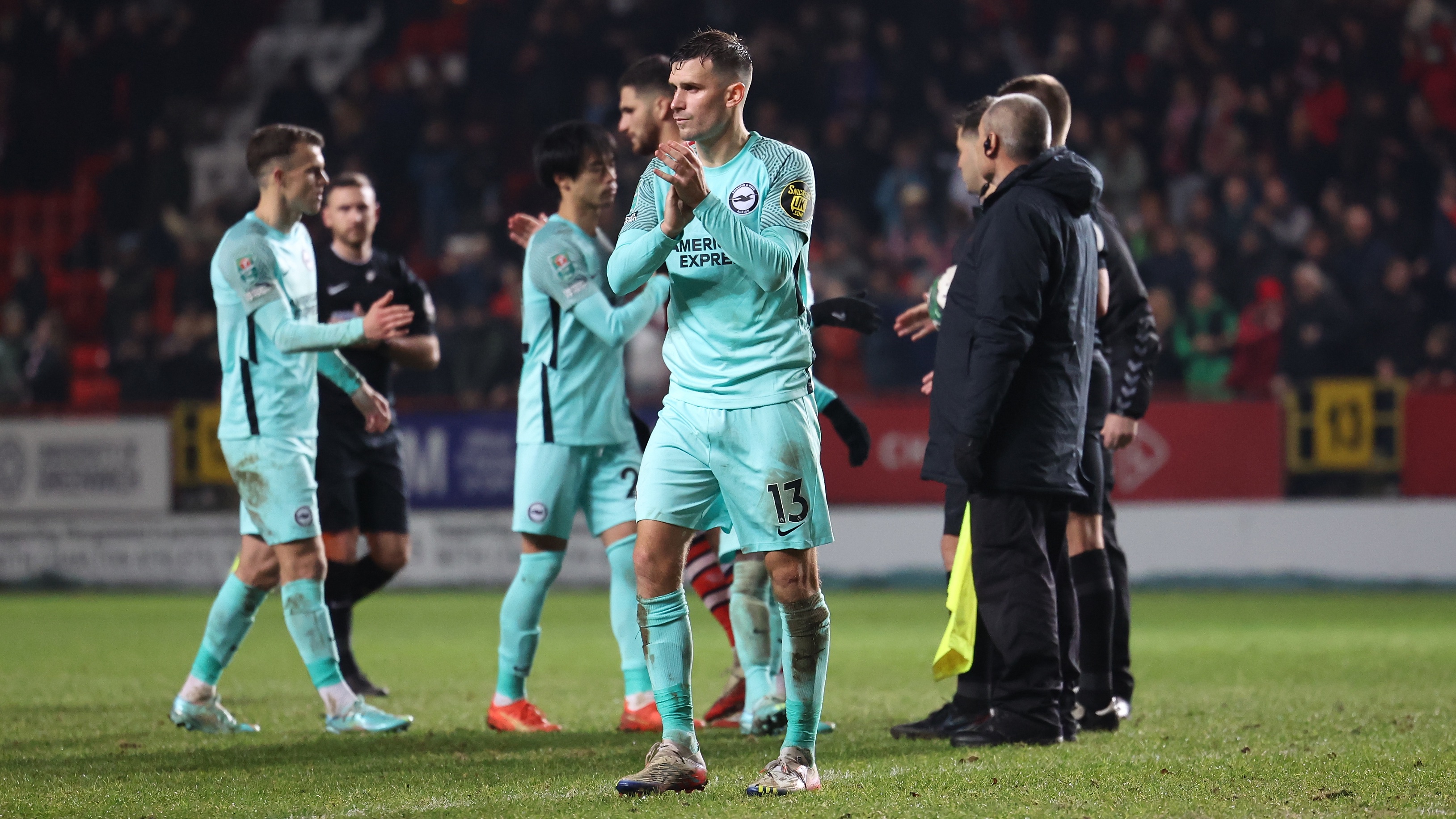 Pascal Gross shows his appreciation to the fans at full time at Charlton.