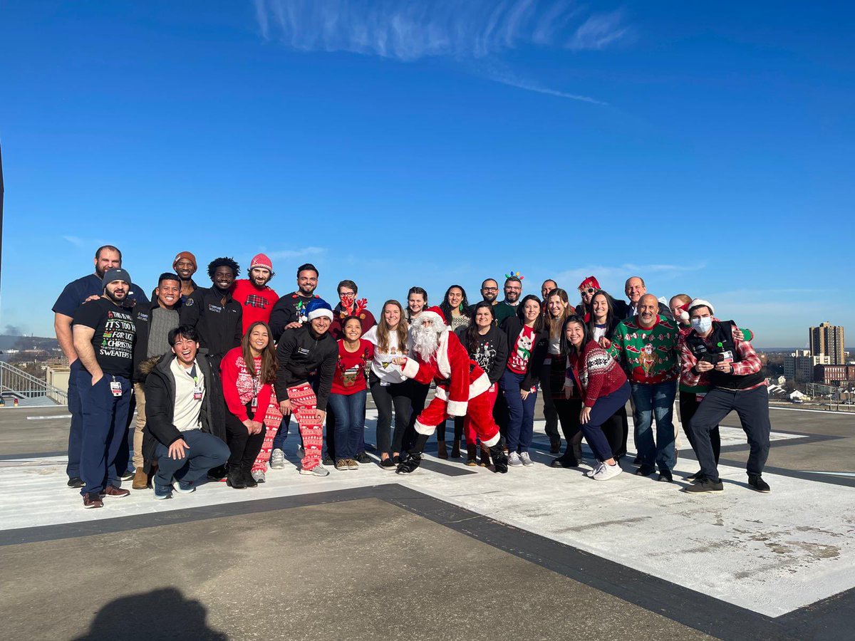 The squad all up on the helipad for the <a href="/StJoesEM/">St. Joseph’s EM</a> fam holiday photo! #family #emergencymedicine #wellness #madlove