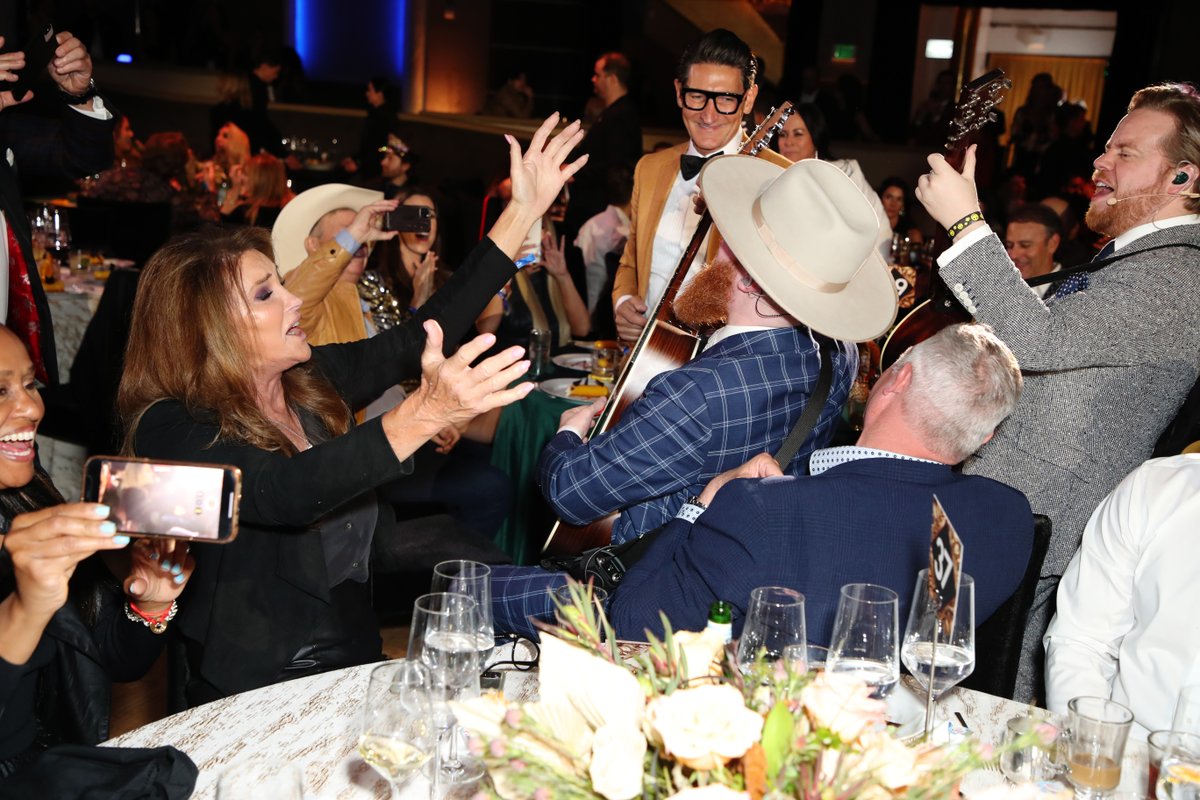 JaniesFund's tweet photo. #TBT to @Caitlyn_Jenner and @EssentialsTweet having the time of their lives at the 2022 GRAMMY Awards #ViewingParty, benefiting the work of #JaniesFund x @youthvillages

For details on how you can attend in 2023, email JaniesFund@AABProductions.com 🎉💙🎉

#JamForJanie https://t.co/RzJeN3CGdX