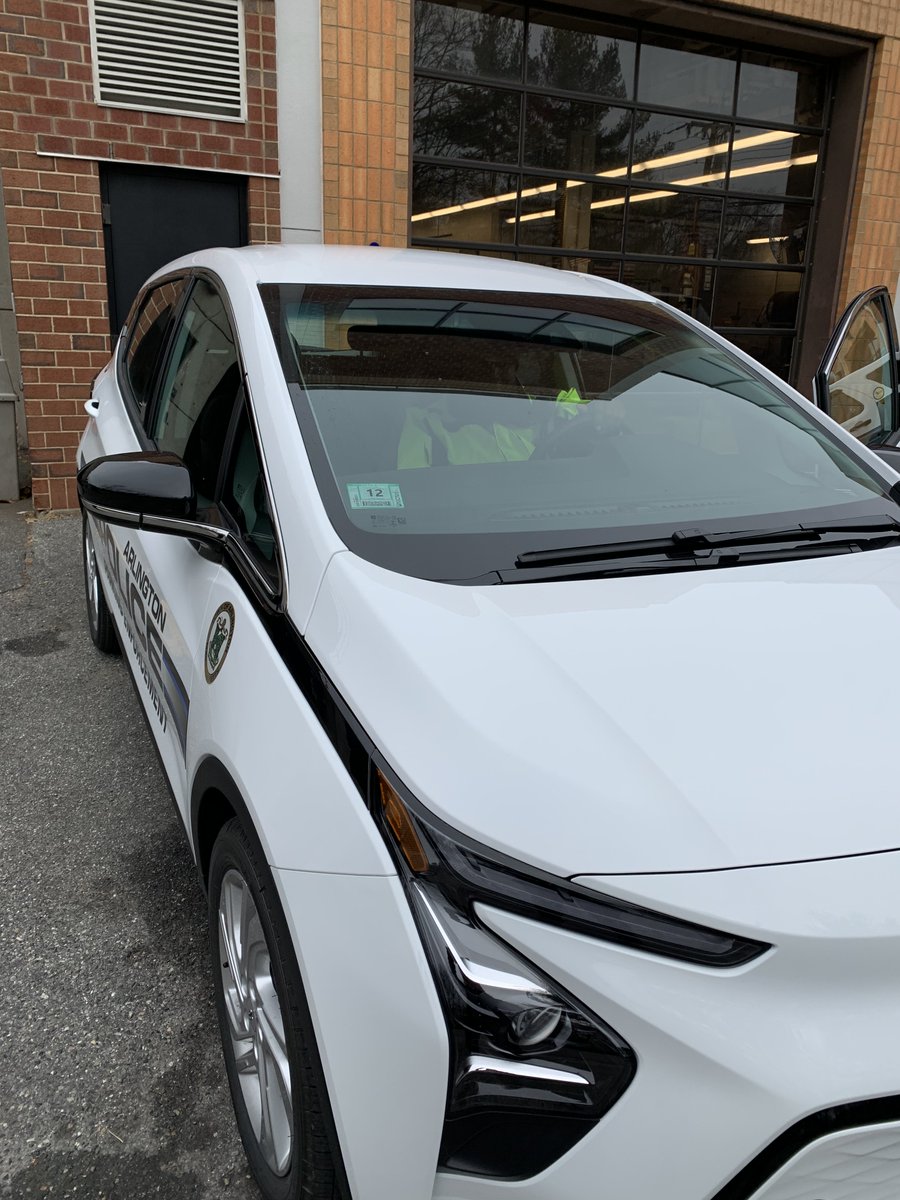 ArlingtonMAPD's tweet photo. You might see PCO Smith in this new car around town. We had the previous Smart Car for 6 yrs & it has been replaced by this Chevy Bolt. This new car can now be serviced locally & has an extended driving range. #ParkingControl #ArlingtonMA https://t.co/lmXh90qphu
