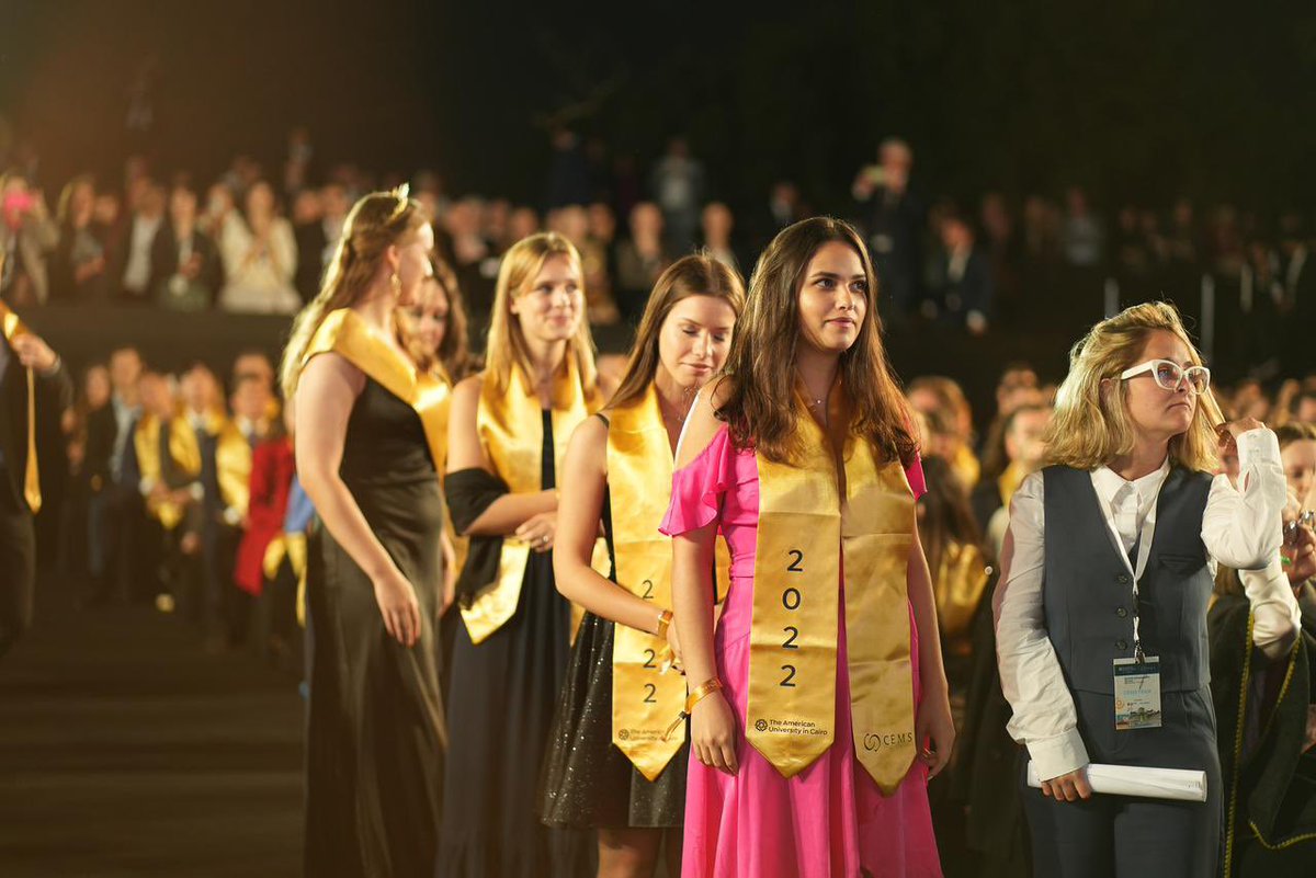 AUC_Business's tweet photo. #Throwback to the CEMS MIM Graduation: graduates from across the globe commemorating a special graduation day at the Pyramids of Giza.

What better way is there than to celebrate with your loved ones? 

#CEMSAnnualEvents #CEMSGraduation22 #CEMSXCairo #CEMSMIM #BusinessSchools https://t.co/jk7BYZTBVR