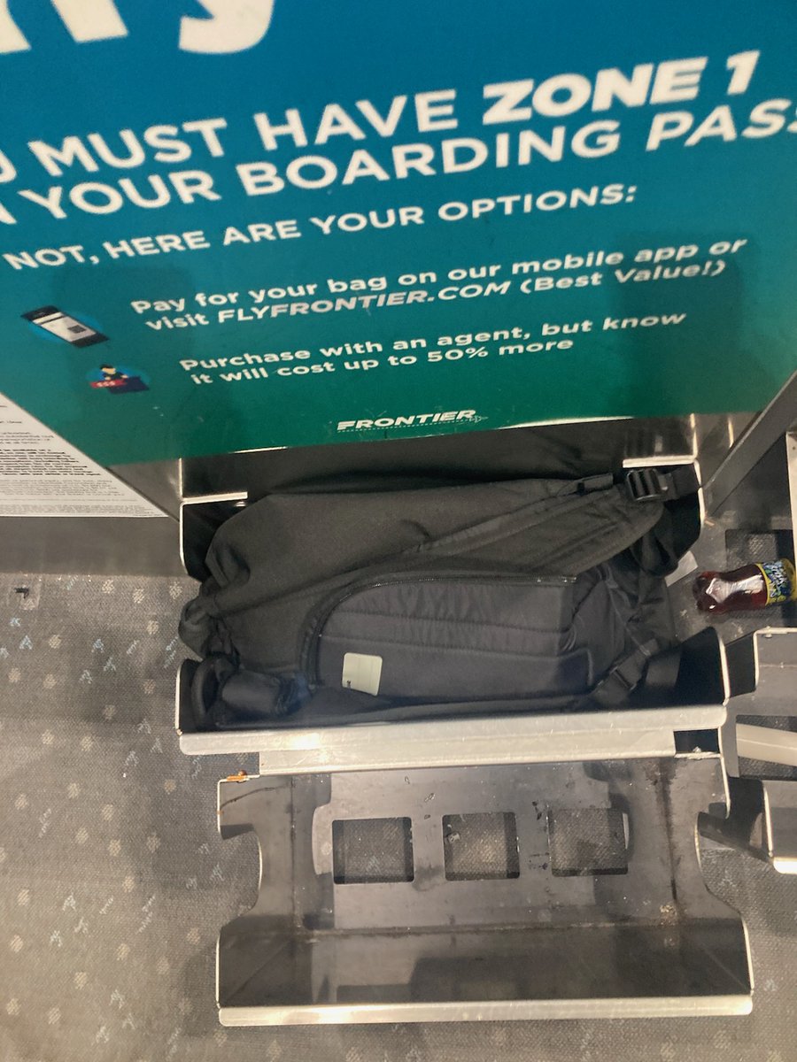 reads_10's tweet photo. They also made @KevinDoodles pay NINETY NINE DOLLARS for this bag, even though it clearly fits.  @FlyFrontier, why do you hate your customers? https://t.co/E3tfqIS0zw
