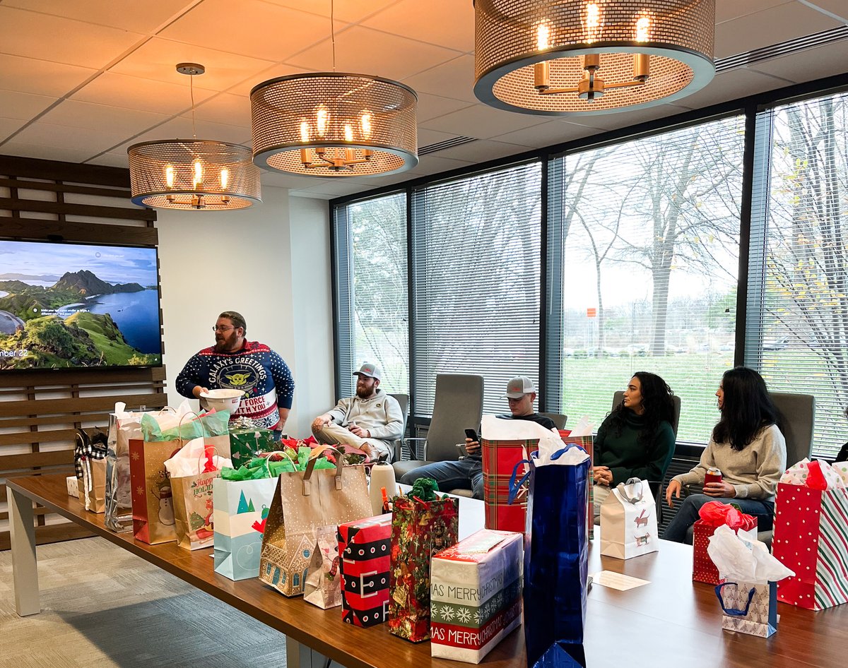 BELLConstCo's tweet photo. We had a holly jolly time at The Annual Office Christmas Party. Our party rules? No gift is safe during our white elephant exchange and the uglier the sweater the better the party! #BELLFamily https://t.co/b2DPs2SvvN