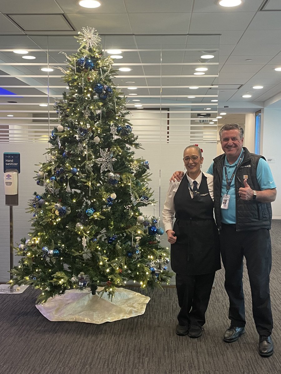 MCO Director Steve Tanzella recognizing an employee from Business Partner who decorated this tree in our UA Club.