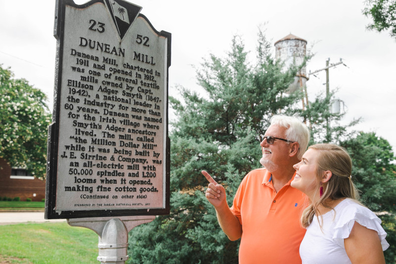 Discover_SC's tweet photo. In this episode of Go For It, Devyn gets a history lesson close to home when she brings her dad along on a @gvilletours of the textile mill villages where her family lived and worked. https://t.co/gsab3e0O6B #DiscoverSC #GoForItSC @SCETV @UpcountrySC @SC_LakeHartwell https://t.co/fOq2PbxOYt