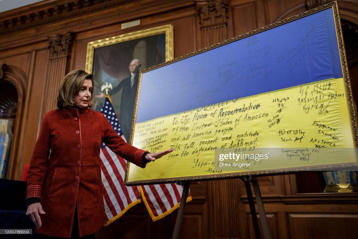 Speaker of the House Nancy #Pelosi displays a Ukrainian flag signed by members of Ukraine's military that was gifted to Congress from President of #Ukraine Volodymyr Zelensky, following a bill enrollment ceremony for the National Defense Authorization Act #NDAA 📸: @drewangerer