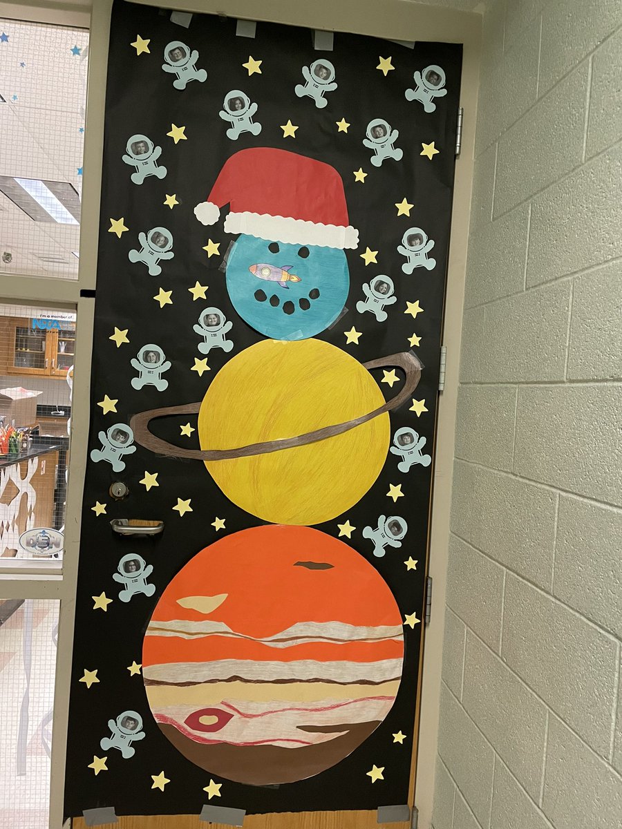 My classroom door my 8th graders helped me decorate for the holidays this year ❤️🪐🌎