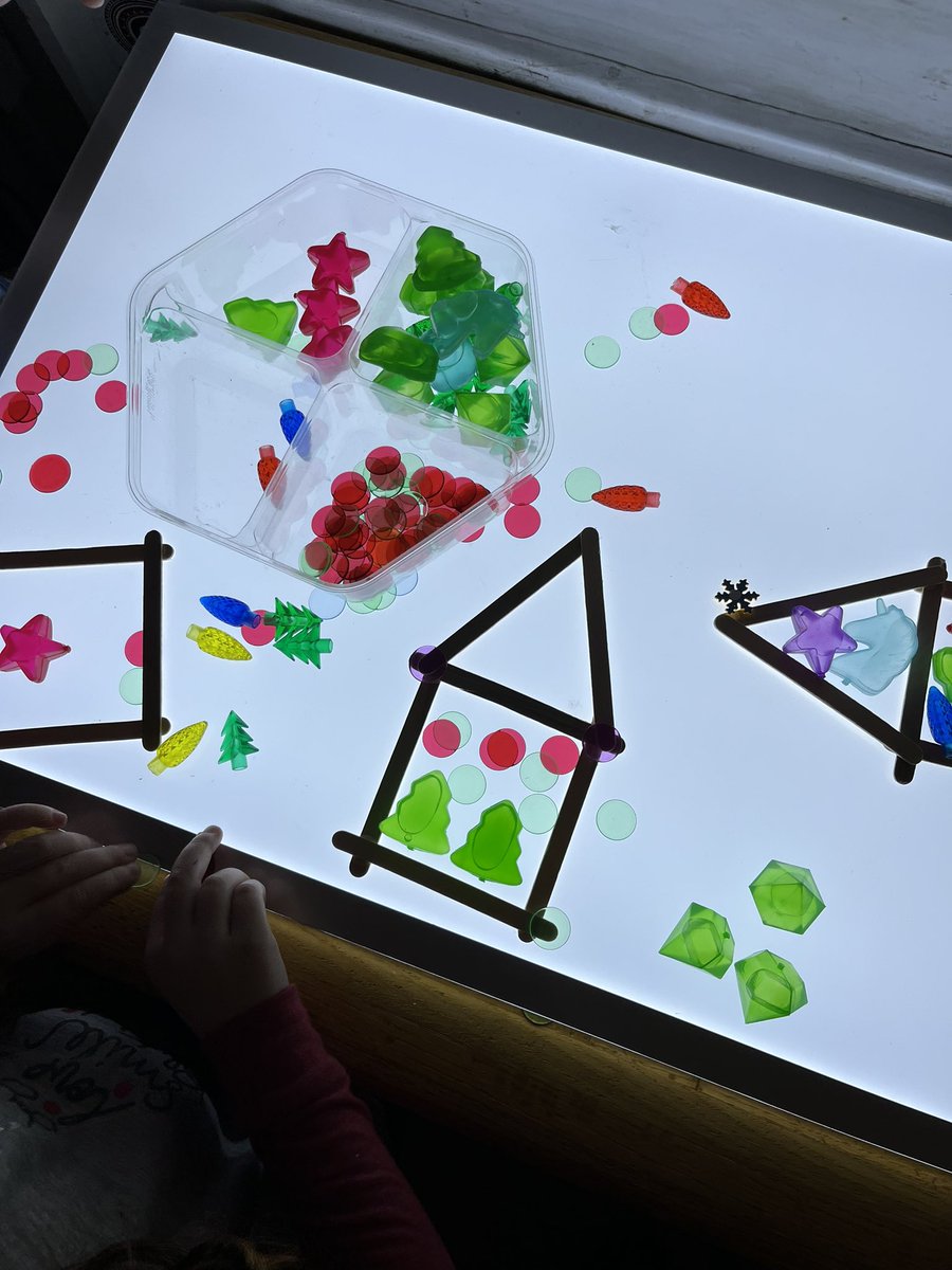 We were feeling festive today! Decorating trees and creating gingerbread houses at the light table. #Kindergarten #festivefun #creating