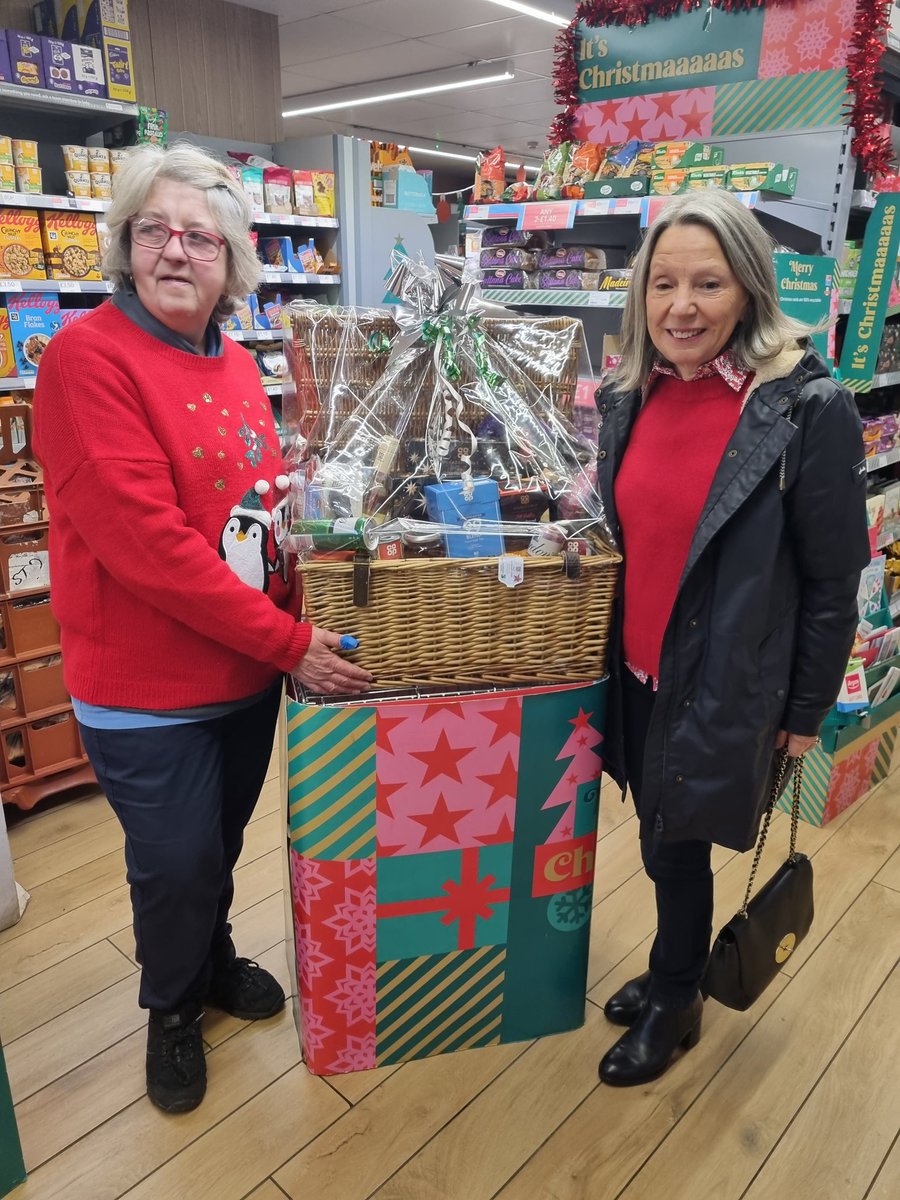 Kilmacolm's very own Sheila presenting the Xmas hamper to the winner! Which has raised over £1000 which will be split between, C.H.A.S and Dementia Friendly Inverclyde which are two charities that are close to the stores hearts. We'll done team and customers! 😁👌