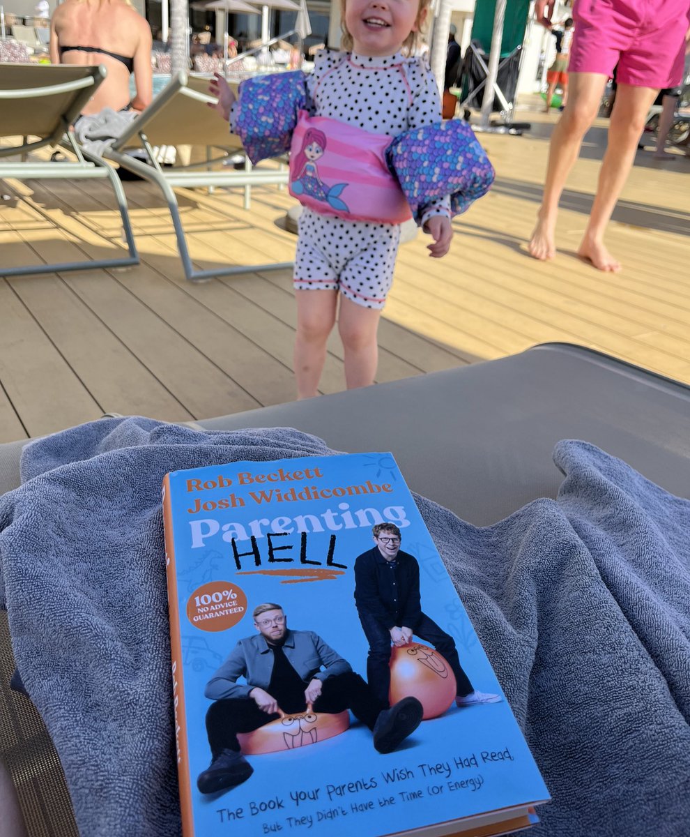 little_ktb's tweet photo. “Relaxing” by the pool with @joshwiddicombe and @robbeckettcomic #parentinghell book. It’s so funny, I don’t want to put it down…but Brodies got her Puddle jumper on ready to get in and out the pool 40,000 times in the next 10mins. https://t.co/yM2YlKAZaB