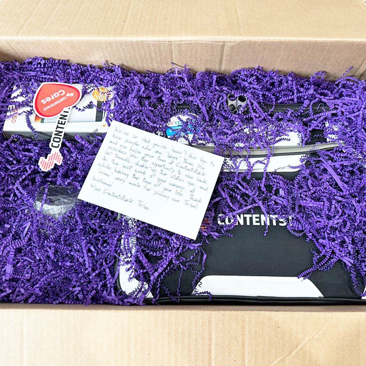 Contentstack's tweet image. Santa&apos;s elves work hard but our People team works harder to make new #team members feel welcomed. 

Who doesn&apos;t love a little #swag? 🎁 #LifeAtContentstack

📷: Kate Moon