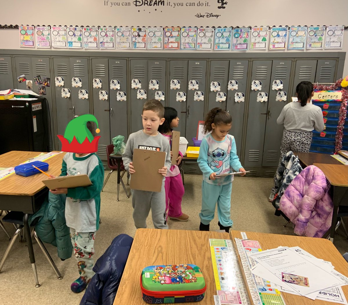 JenMirdala's tweet photo. We went on an elf hunt and taped Mr. Chiera to the wall…what a way to start our winter break! See everyone in 2️⃣0️⃣2️⃣3️⃣!🎉⛄️@IAES18Chiera https://t.co/POGzU6jbxb