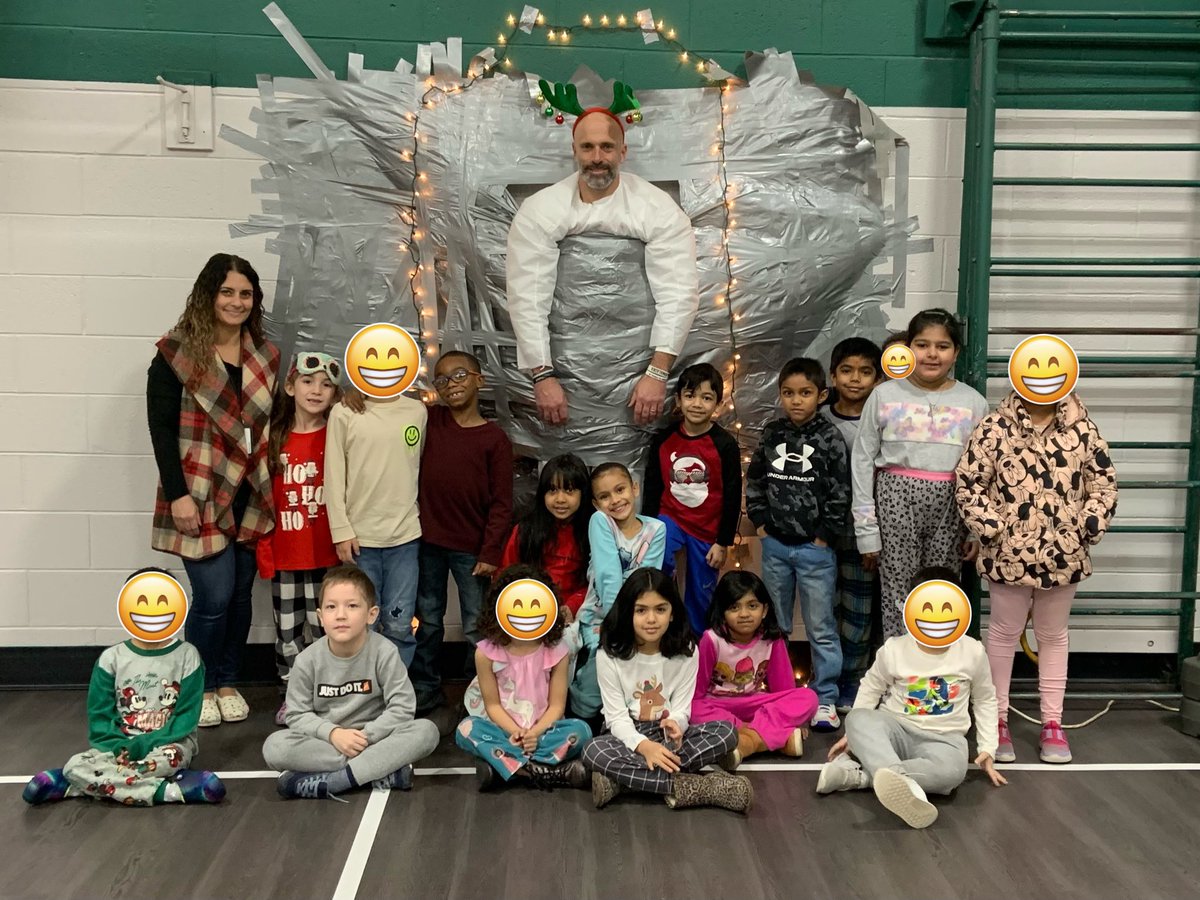 JenMirdala's tweet photo. We went on an elf hunt and taped Mr. Chiera to the wall…what a way to start our winter break! See everyone in 2️⃣0️⃣2️⃣3️⃣!🎉⛄️@IAES18Chiera https://t.co/POGzU6jbxb