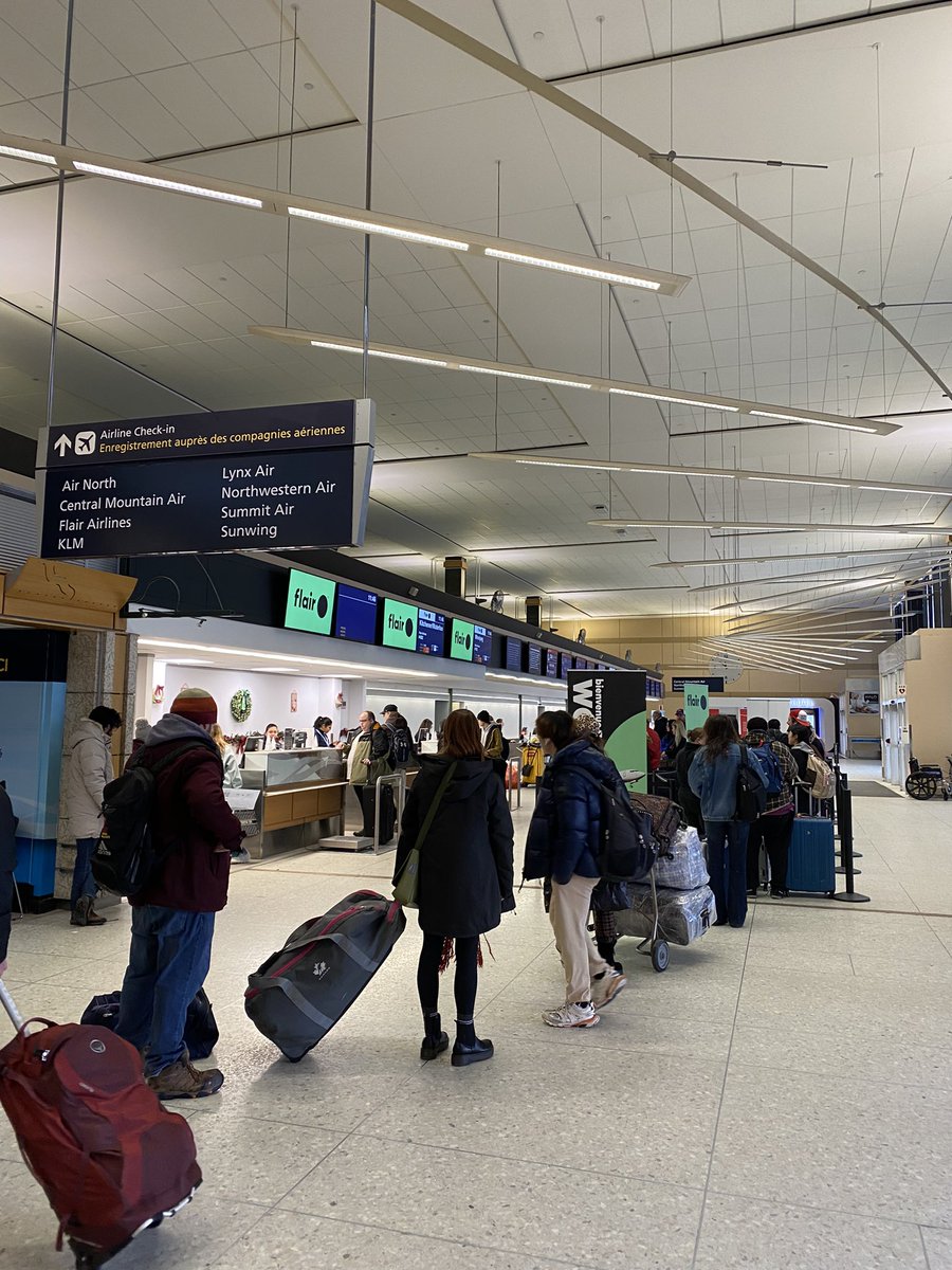 CBCpippa's tweet photo. Moderately busy at @FlyYEG today. The airport has brought out the big dogs - literally! This is Mable and Jack, comforting stressed passengers with wags and smiles 🐶 🥹😍 #BCStorm #ONStorm #edmonton #yeg #yvr https://t.co/yOxoWB750z