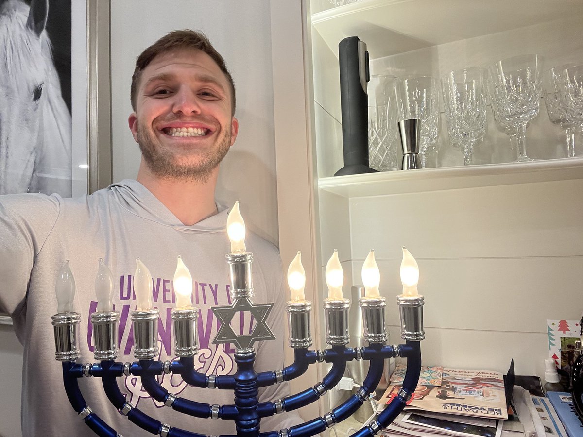 University of Evansville Associate AD Logan Belz is all smiles celebrating Hanukkah. 🕎

#JCA | #CoachesLightCandles | #HappyHanukkah