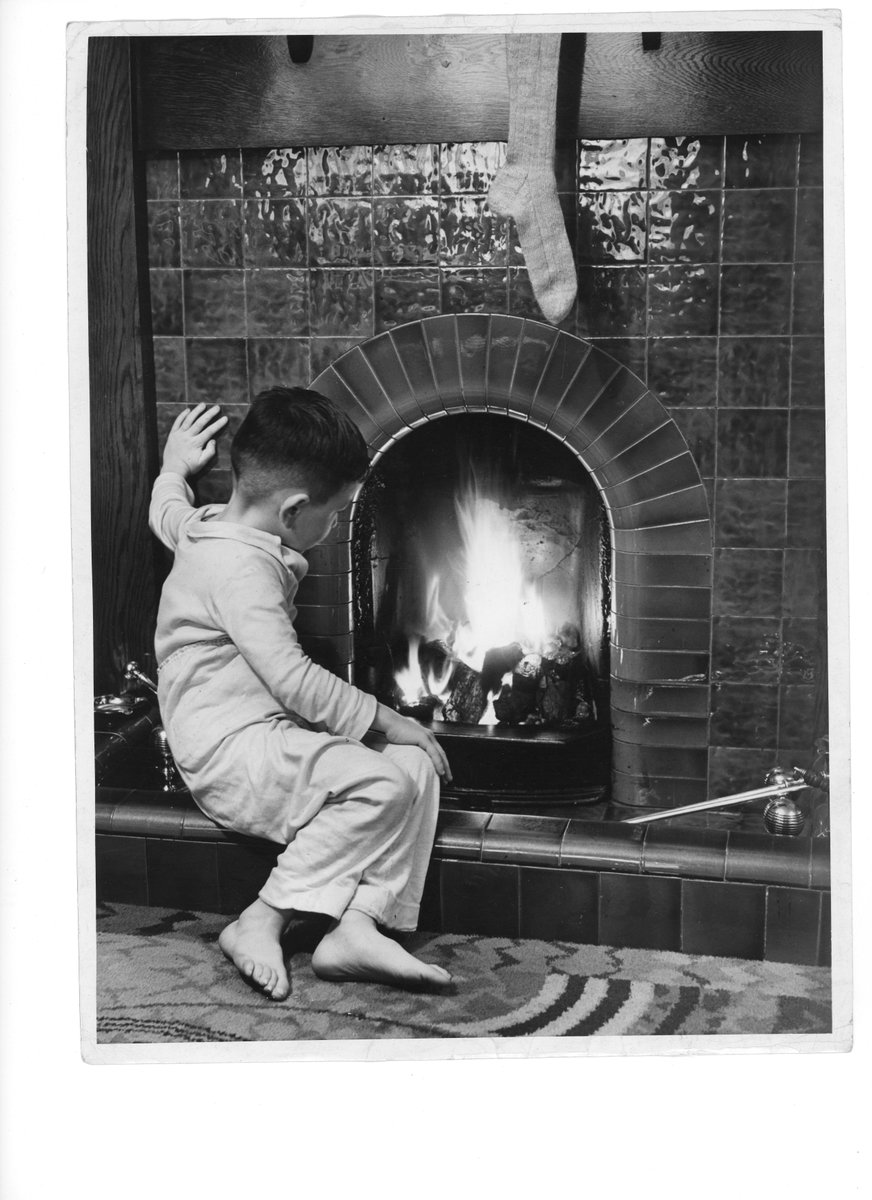 CoopHeritage's tweet image. Today's #12DaysOfArchives is #WarmFire so here is a small boy in front of the fire from the Co-op press collection #ARAScot