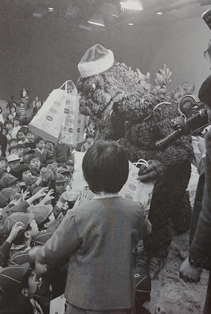 TohoKingdom's tweet photo. Ignoring their cries, Godzilla Claus steals the children's gifts. https://t.co/W5Zat8GGwx