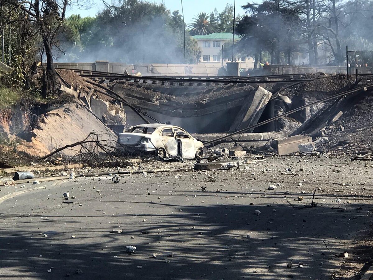TRNOnline's tweet photo. #BoksburgExplosion this is the tanker that got jammed and caught fire under the bridge in Boksburg, claiming lives and leaving many with 3rd degree burns https://t.co/vxpgqztoRa