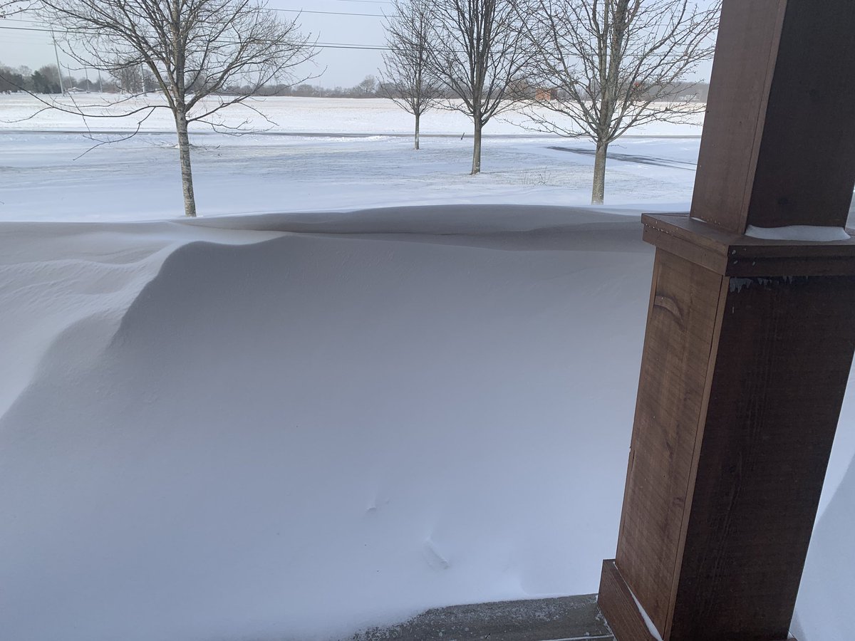 A look outside our front door…a 4 foot snowdrift across the whole house!!