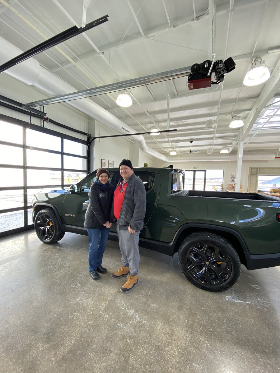 MeganOWittman's tweet photo. My parents picking up their @Rivian today at the plant in our hometown. Excited to be part of the EV fam! https://t.co/AWJERg5Bid